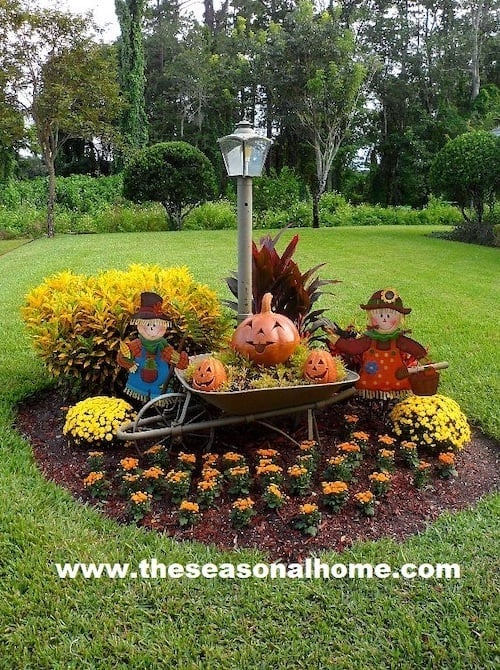 Autumn Outdoor Decorations with a wheelbarrow and fall flowers