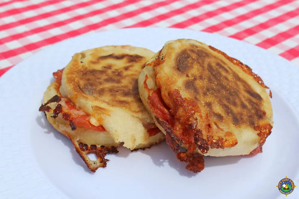 close up of 2 pie iron pizza sandwiches