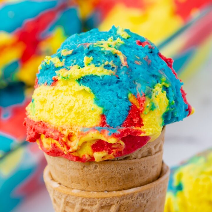 A variety of homemade ice cream flavors including strawberry, vanilla, and mint chocolate chip in colorful bowls.