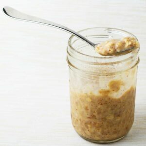 Overnight protein oats in a glass jar.