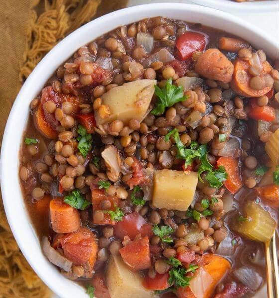 slow cooker lentil soup in white bowl