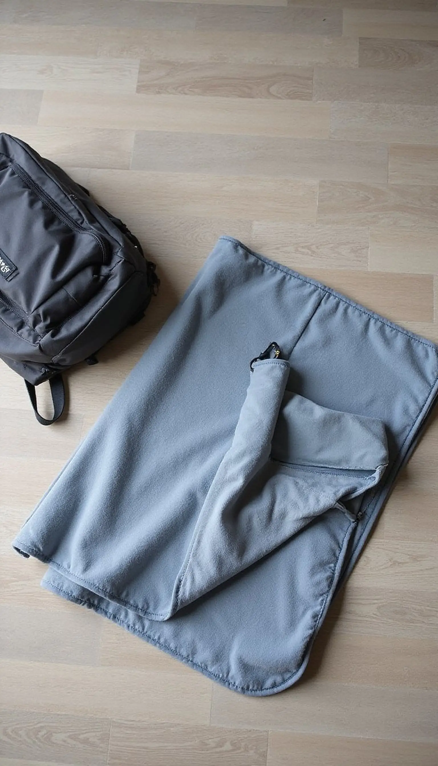Compact travel blanket that folds small