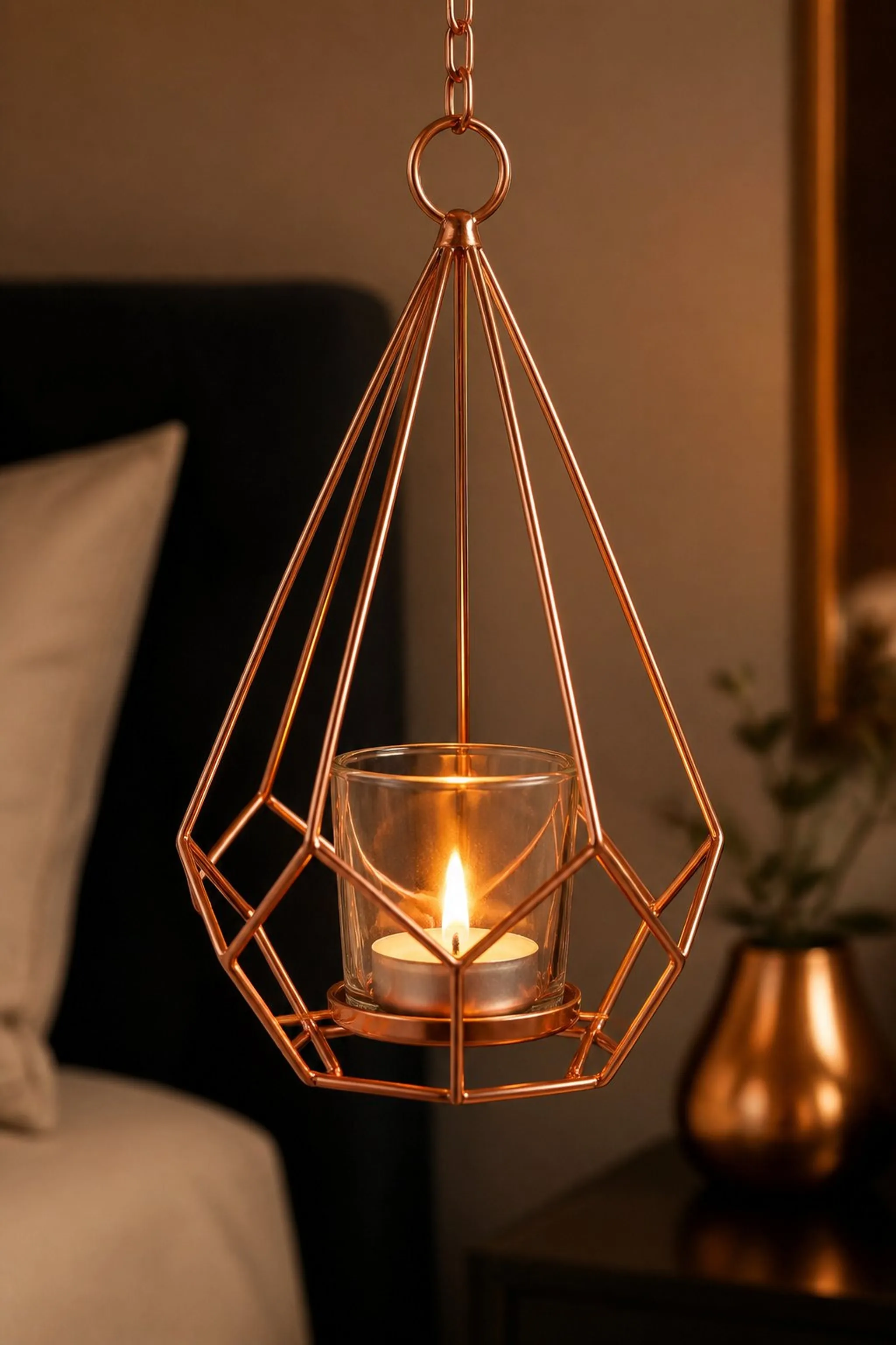 Copper wire frame with suspended candle