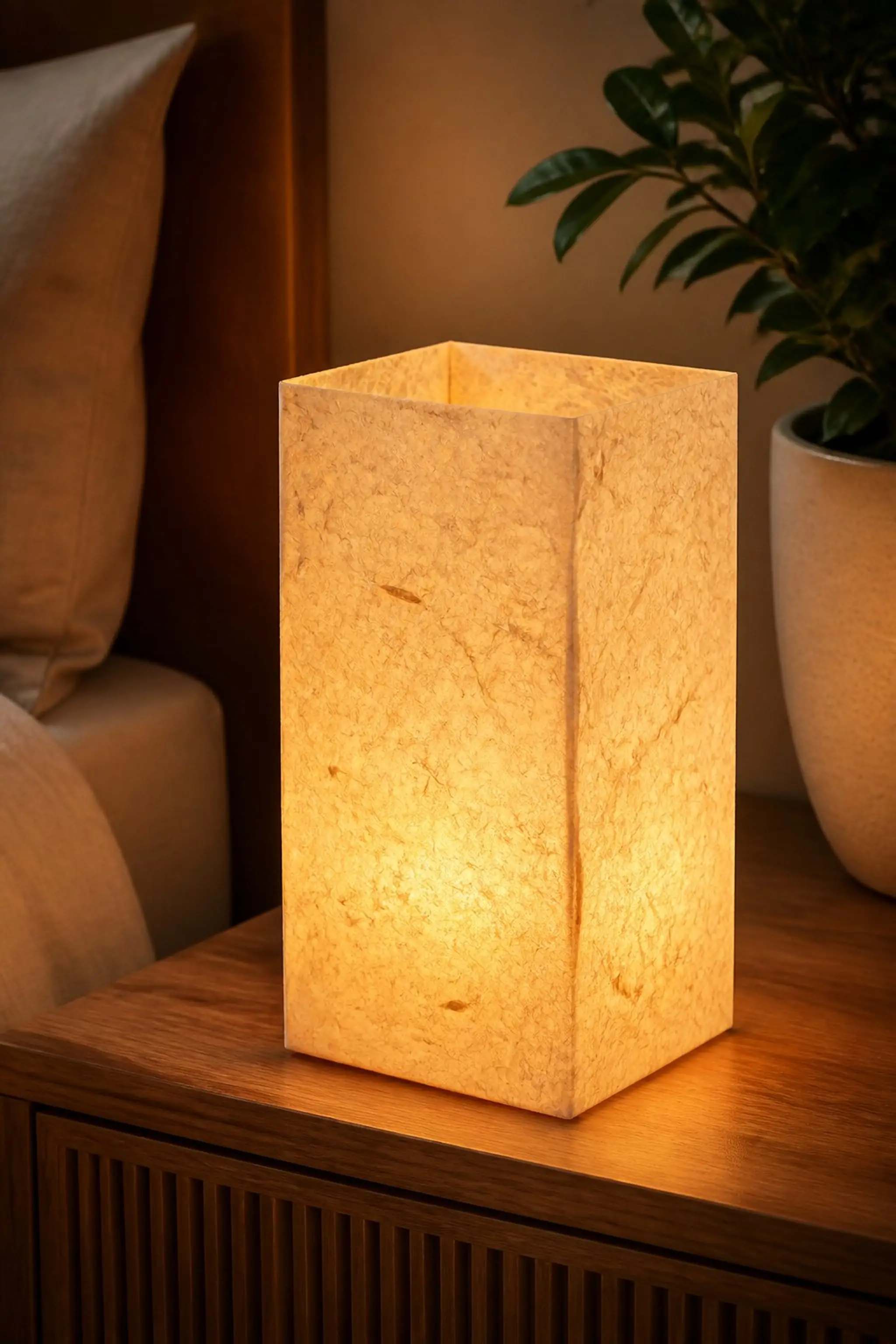 Textured paper lantern with warm glow