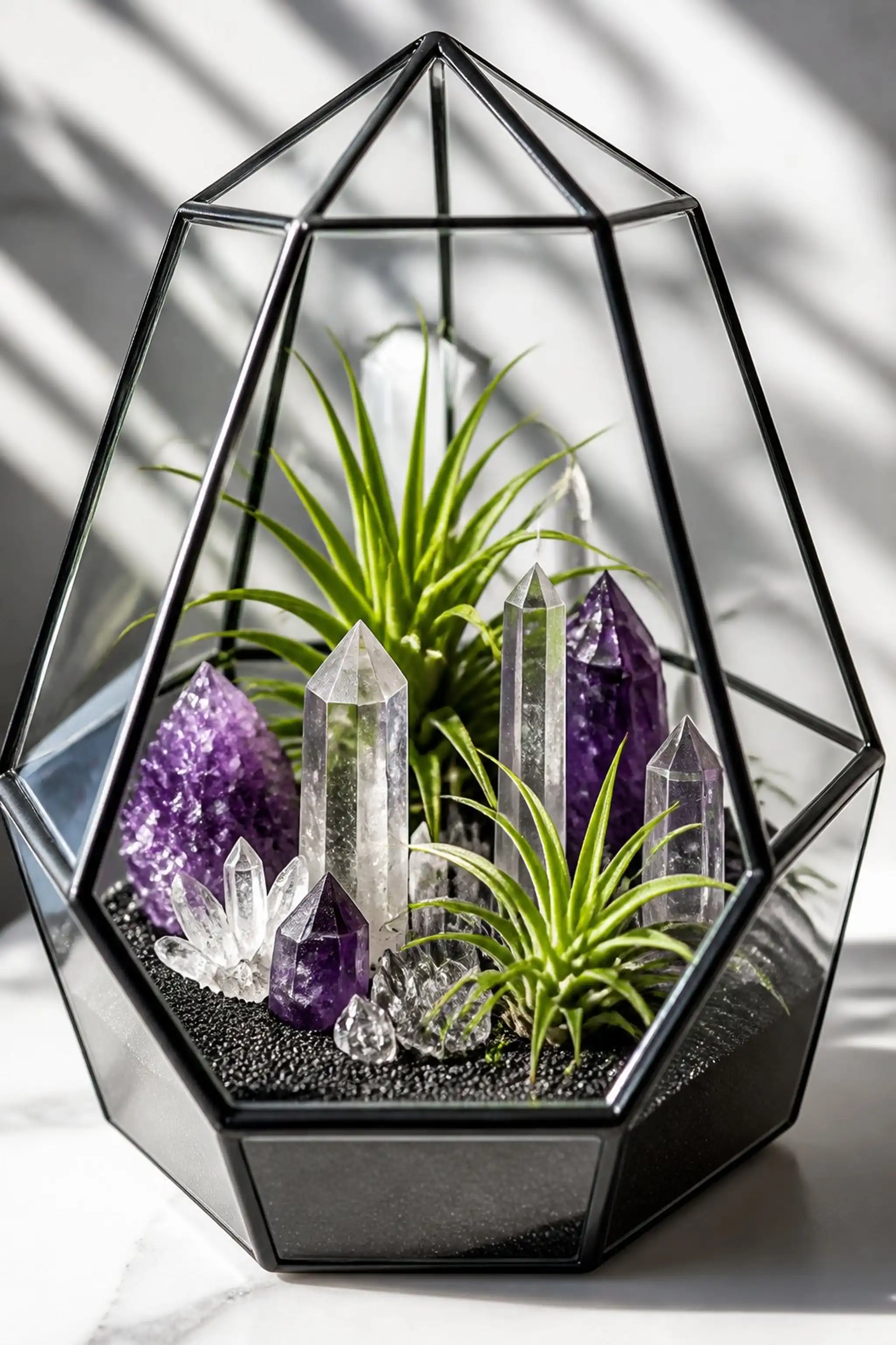 Geometric terrarium jar with air plants and crystals
