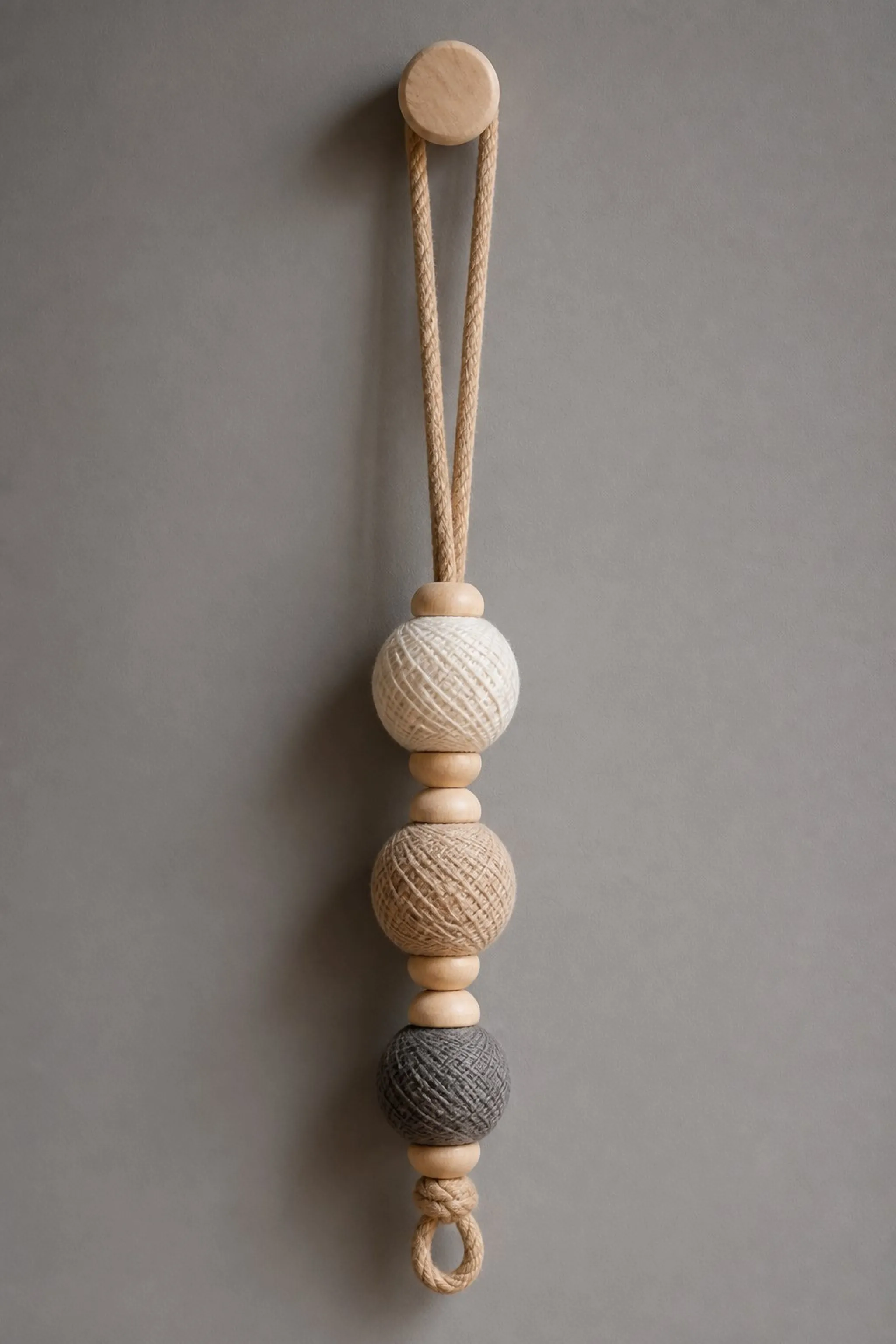Circle knob yarn hanging with natural wood accents