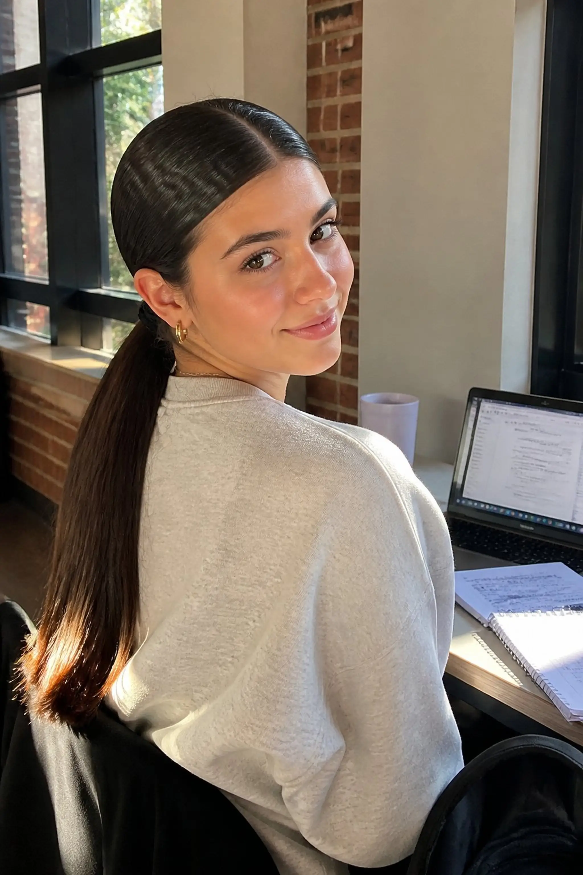 Sleek Low Ponytail With A Center Part