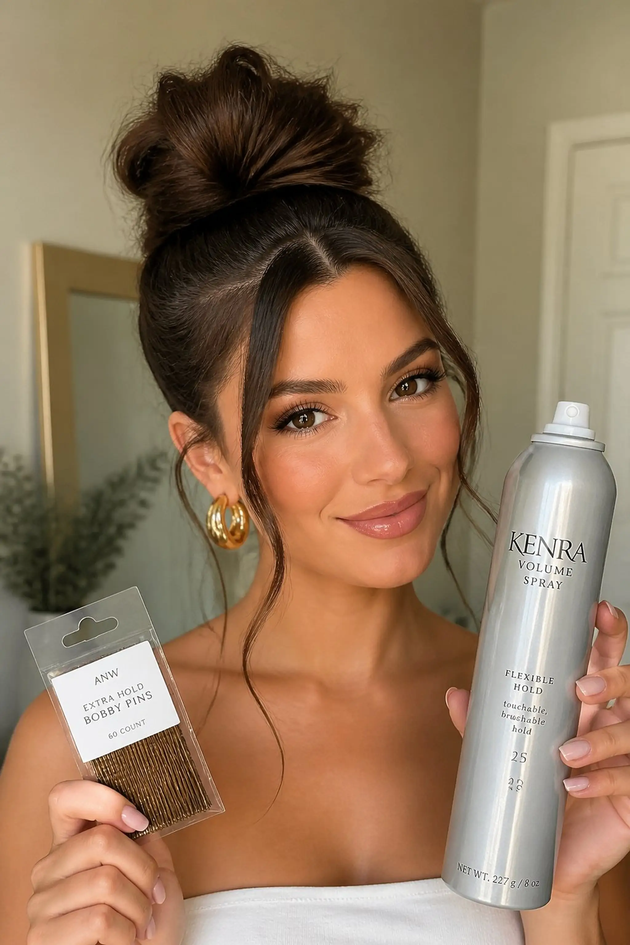 High Bun with Face-Framing Tendrils