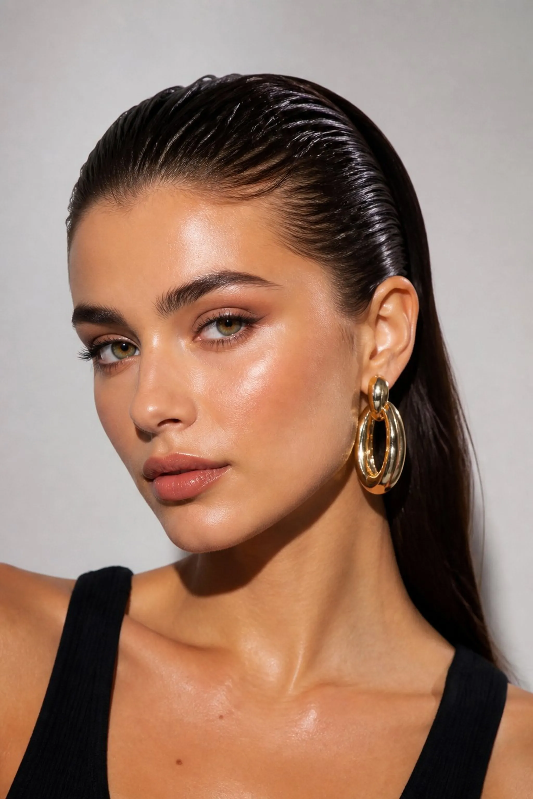 Slicked-Back Wet Look Accentuates Earrings