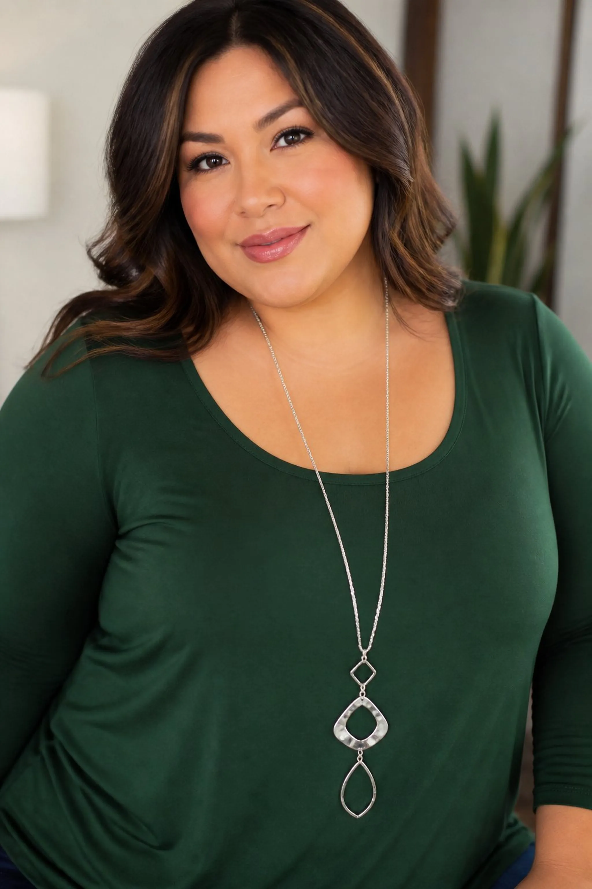 Bold necklaces add vertical interest to outfits