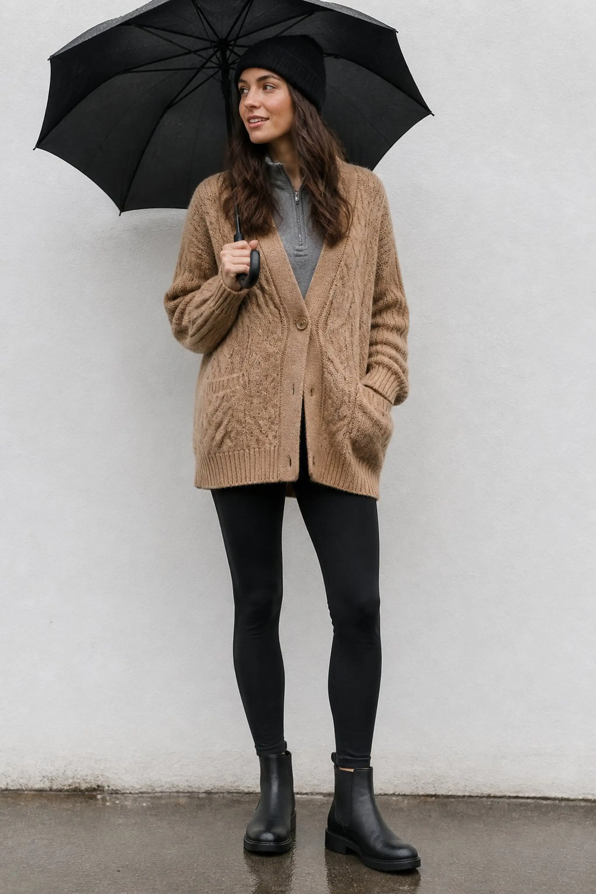 Oversized knit cardigan paired with waterproof leggings