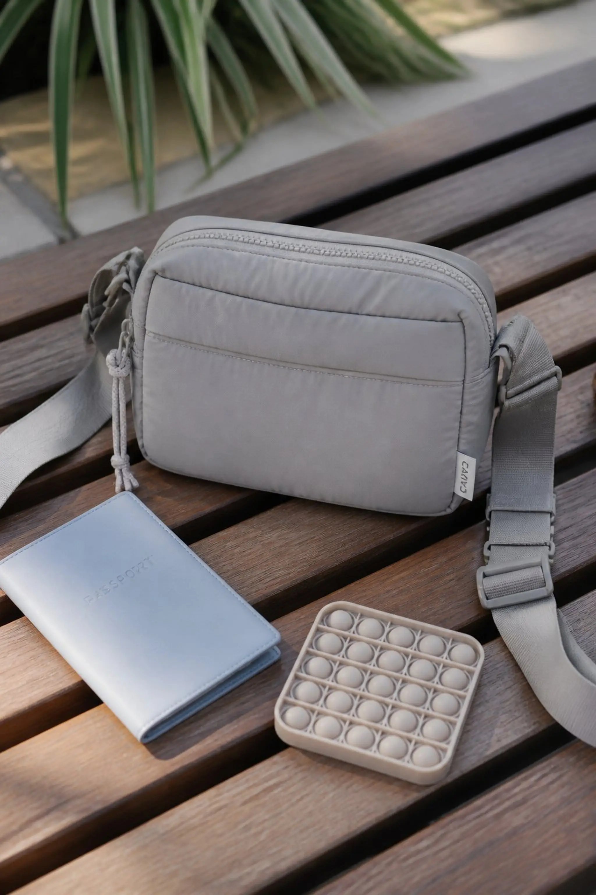 Crossbody bag with soft-touch, padded compartments